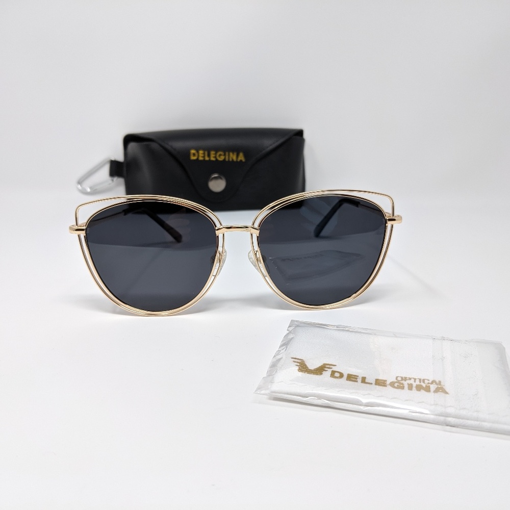 Stylish black sunglasses with bold gold trim - Picture 1 of 4